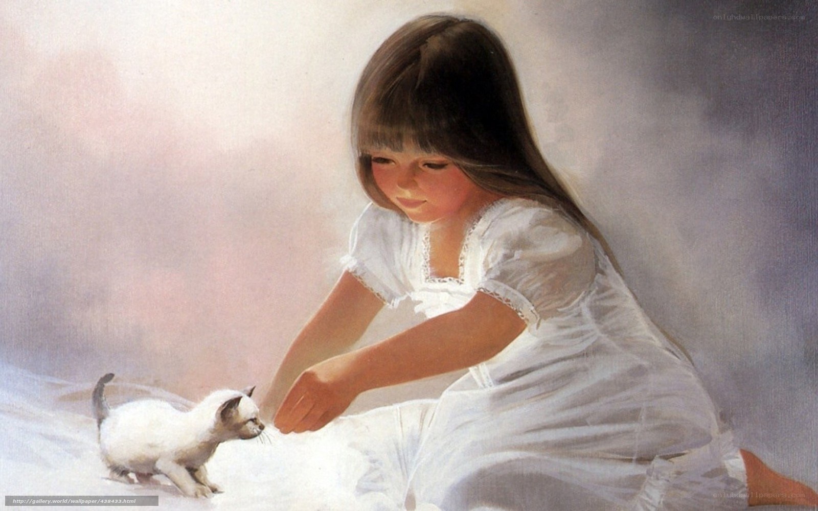 girl playing with kitten