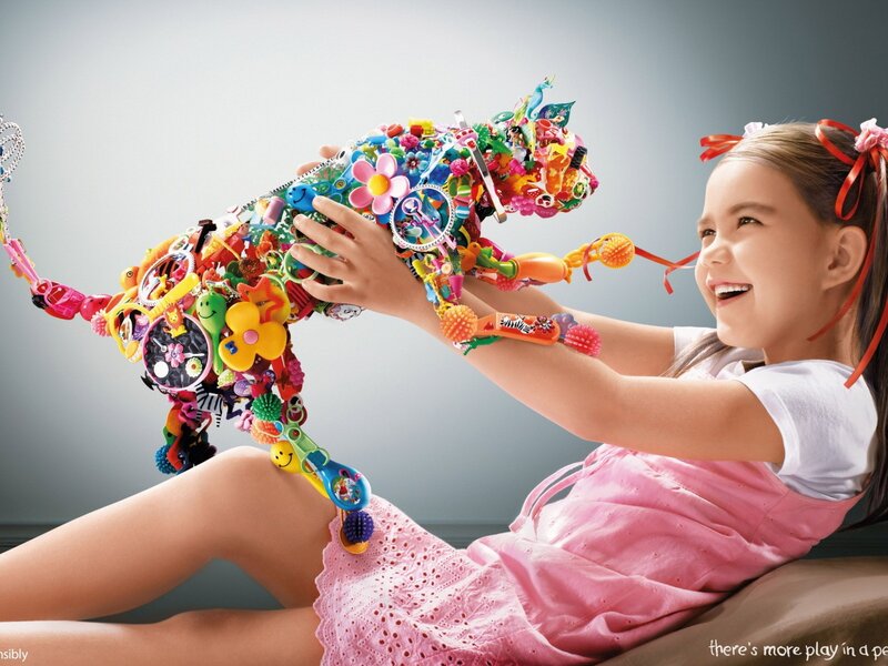 girl playing with toy animal