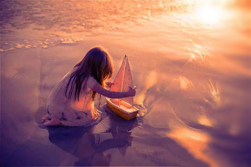 Girl Playing with Toy Boat
