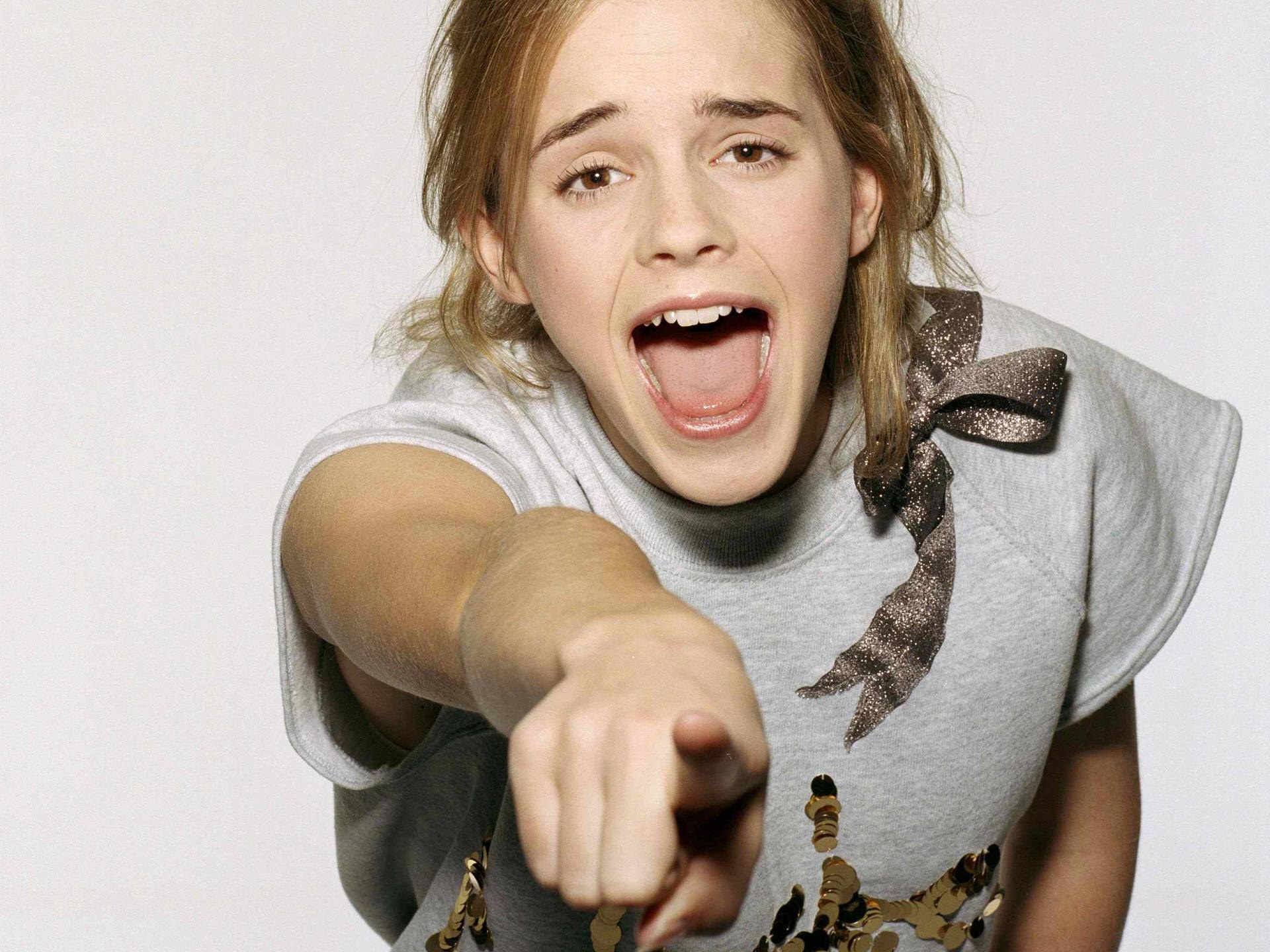 girl pointing at camera