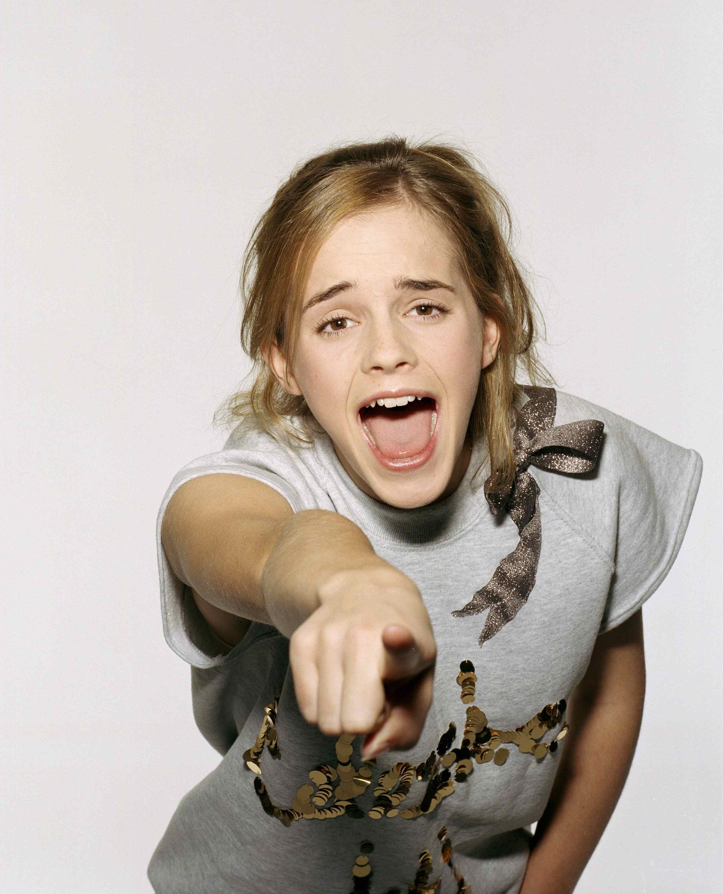 girl pointing at camera
