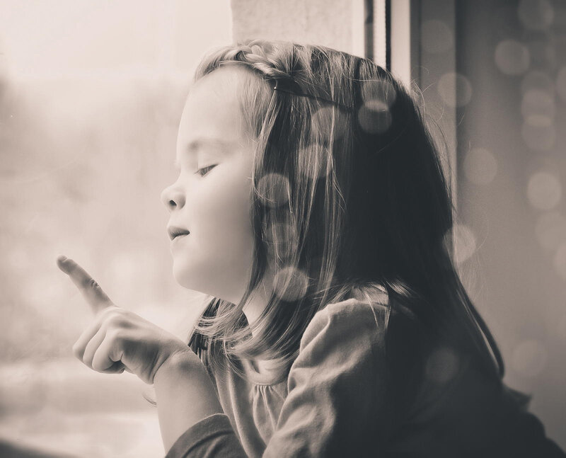 Girl Pointing at Window