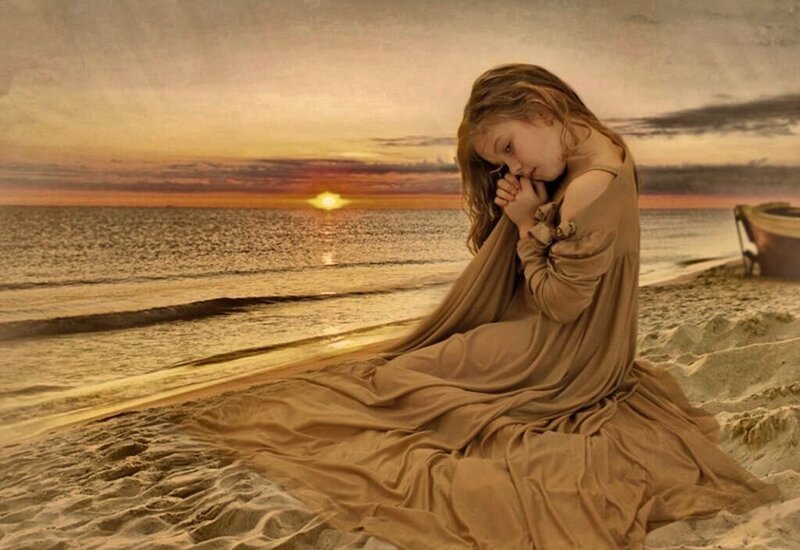 Girl Praying on Beach