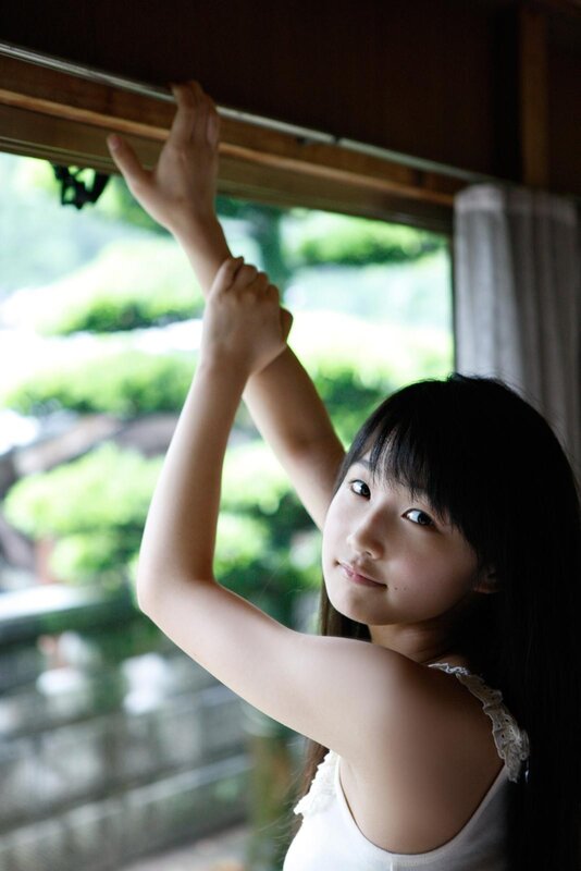 girl reaching for window