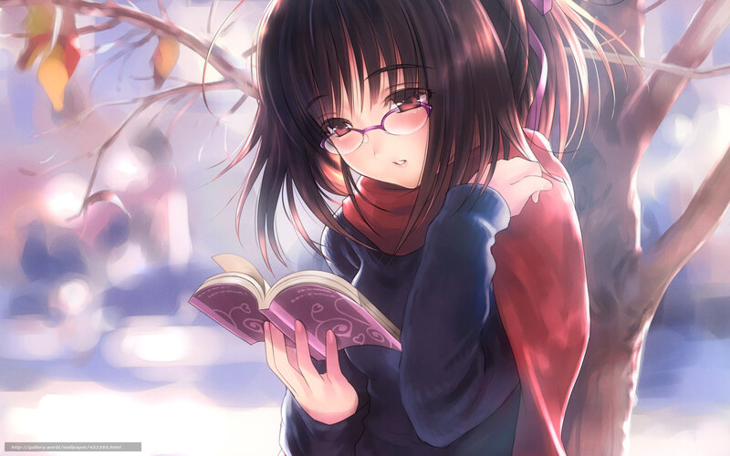 Girl reading book under tree