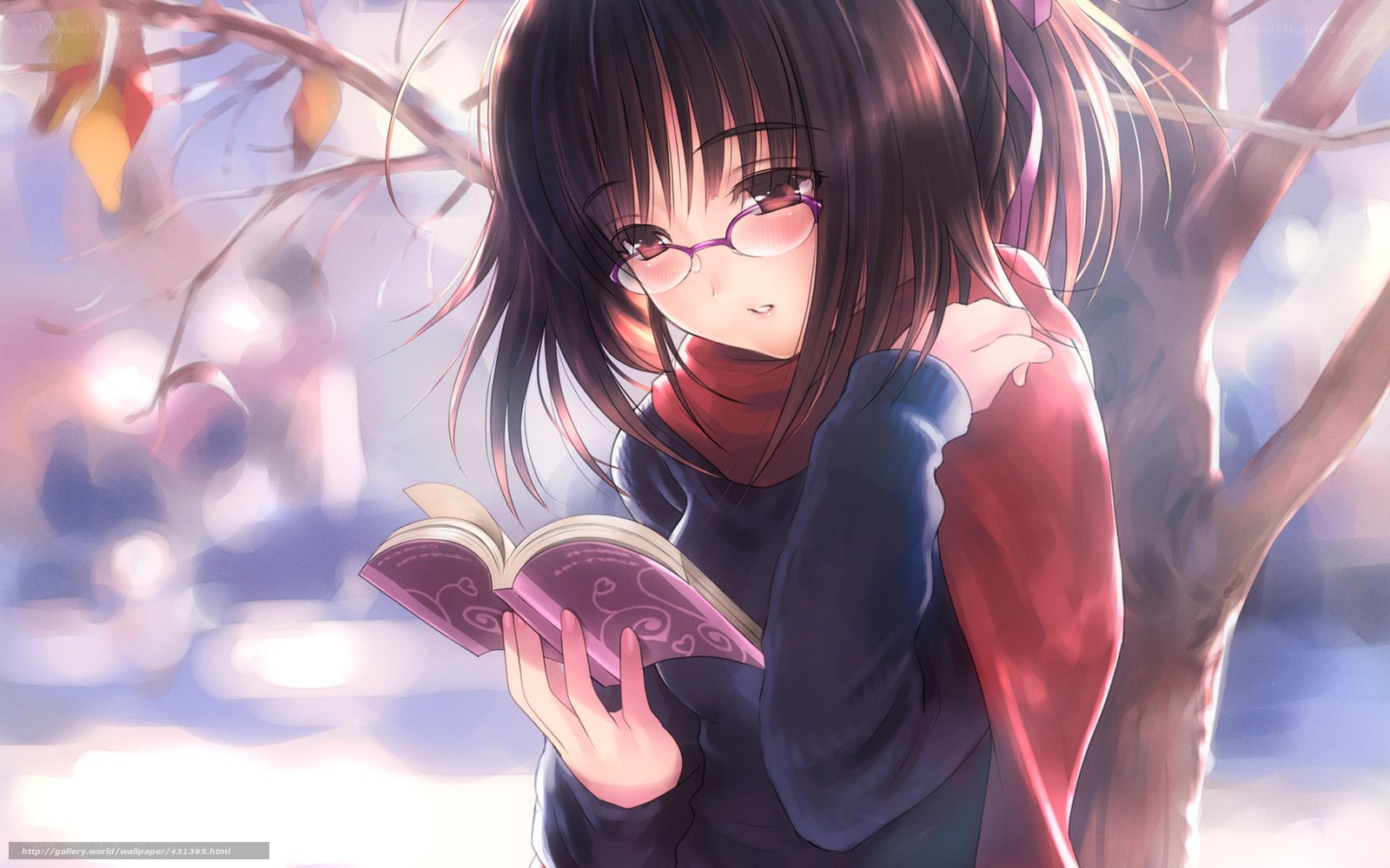 Girl reading book under tree