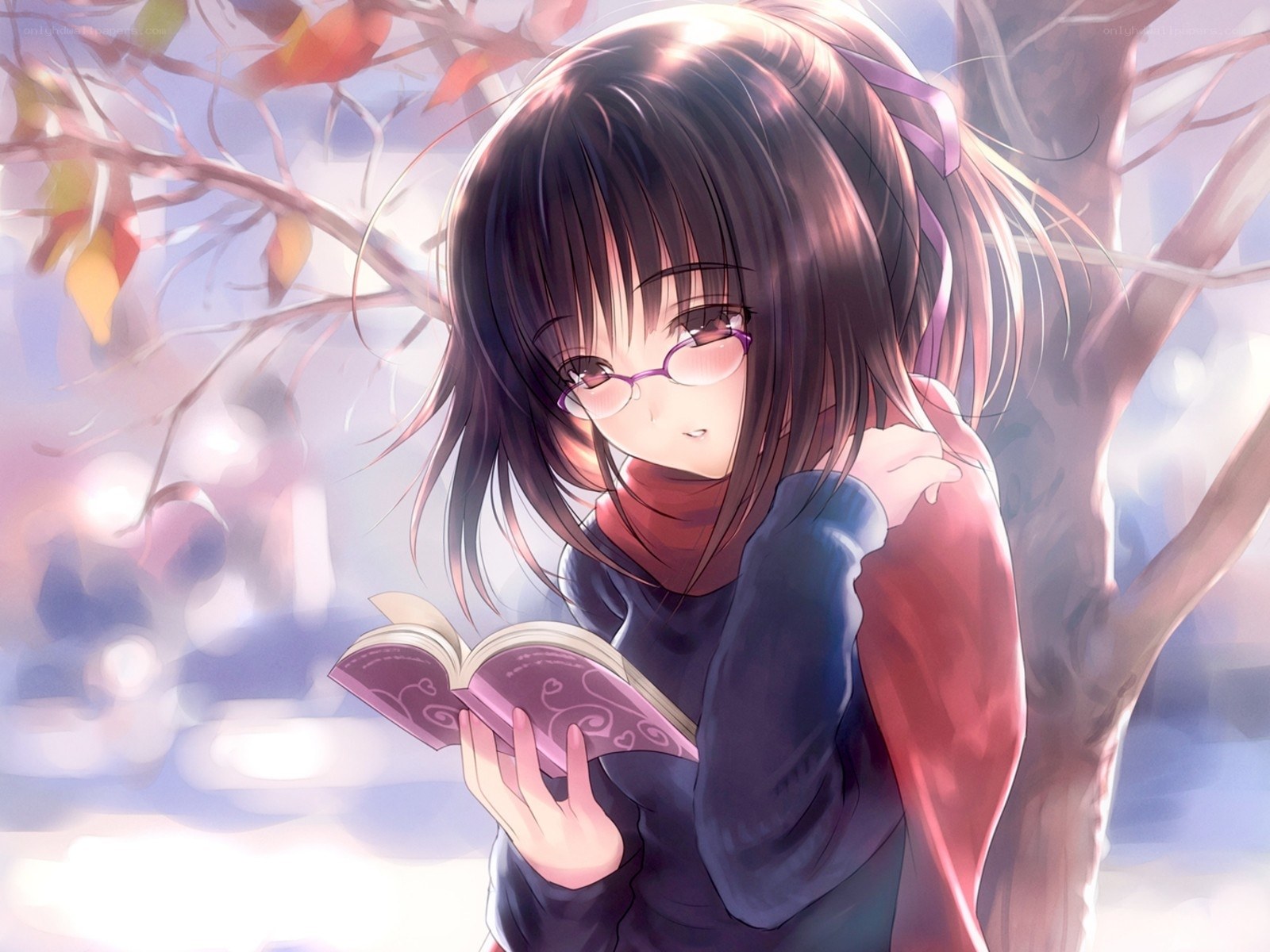 girl reading book under tree