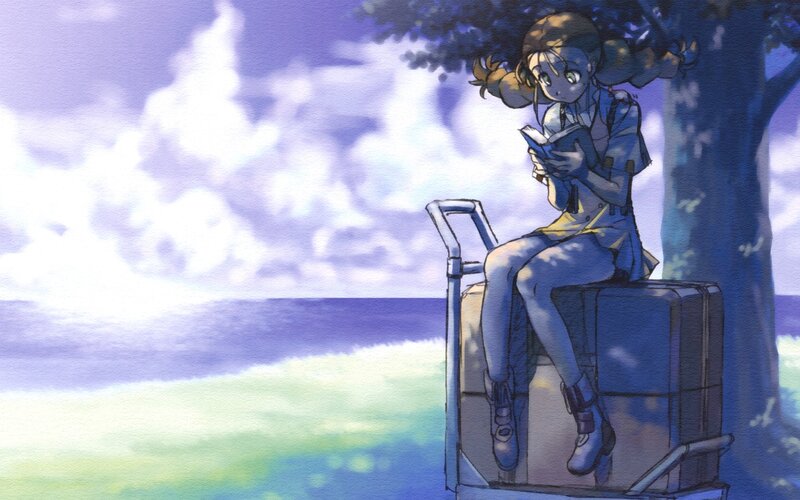 girl reading by the sea