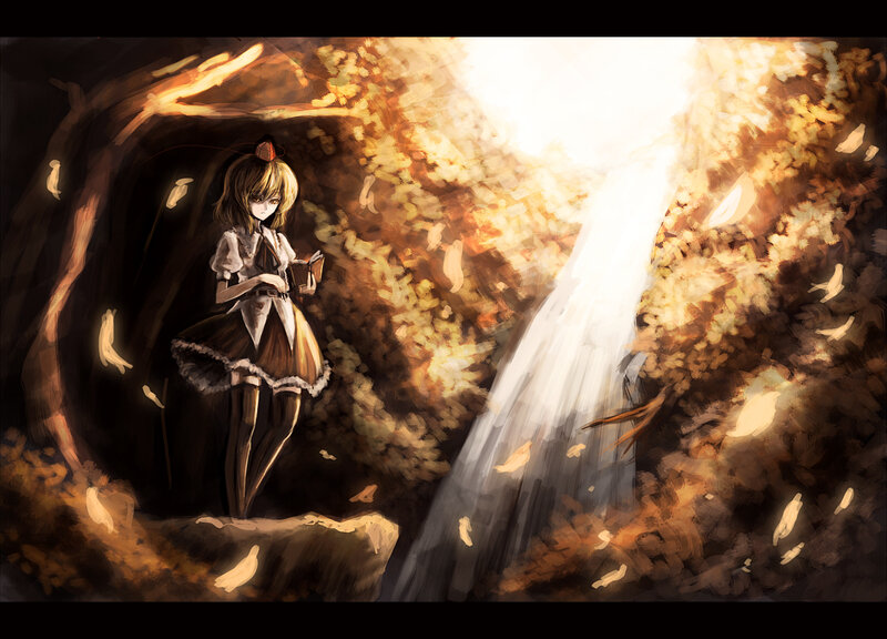 girl reading by waterfall