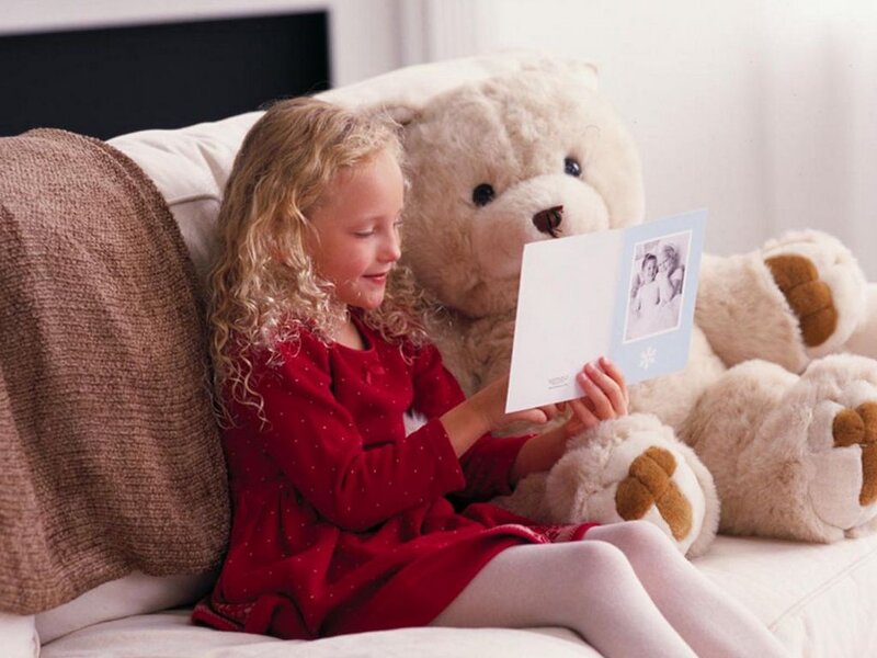 Girl Reading Card