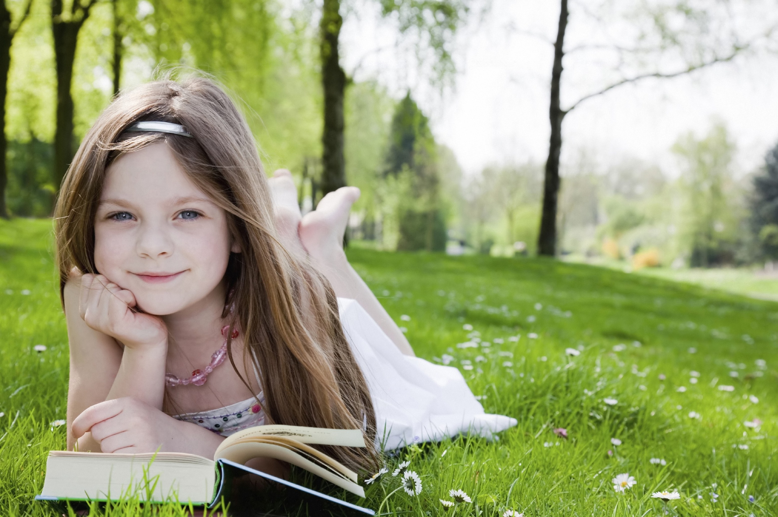 Girl reading in a park