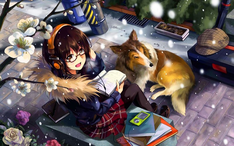 Girl reading with dog in snow