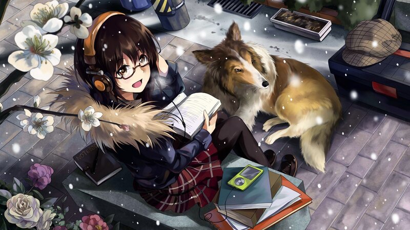 Girl reading with dog in snow