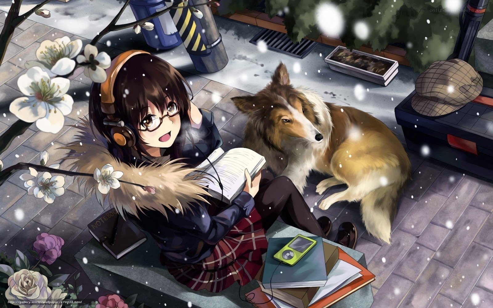 Girl reading with dog in snow