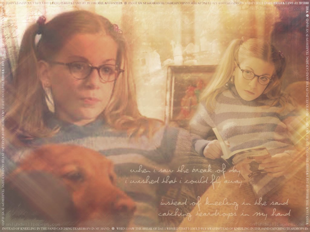 girl reading with dog