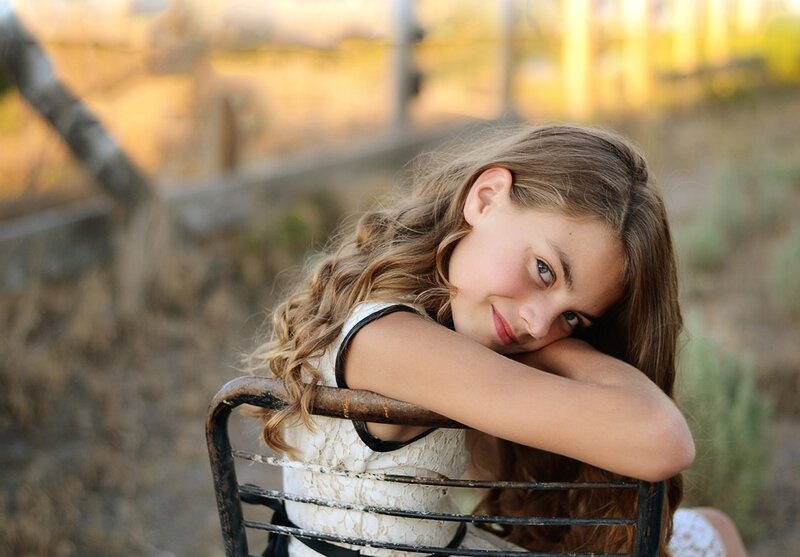 Girl Resting on Chair
