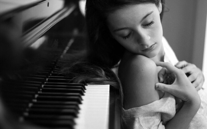 Girl Resting on Piano