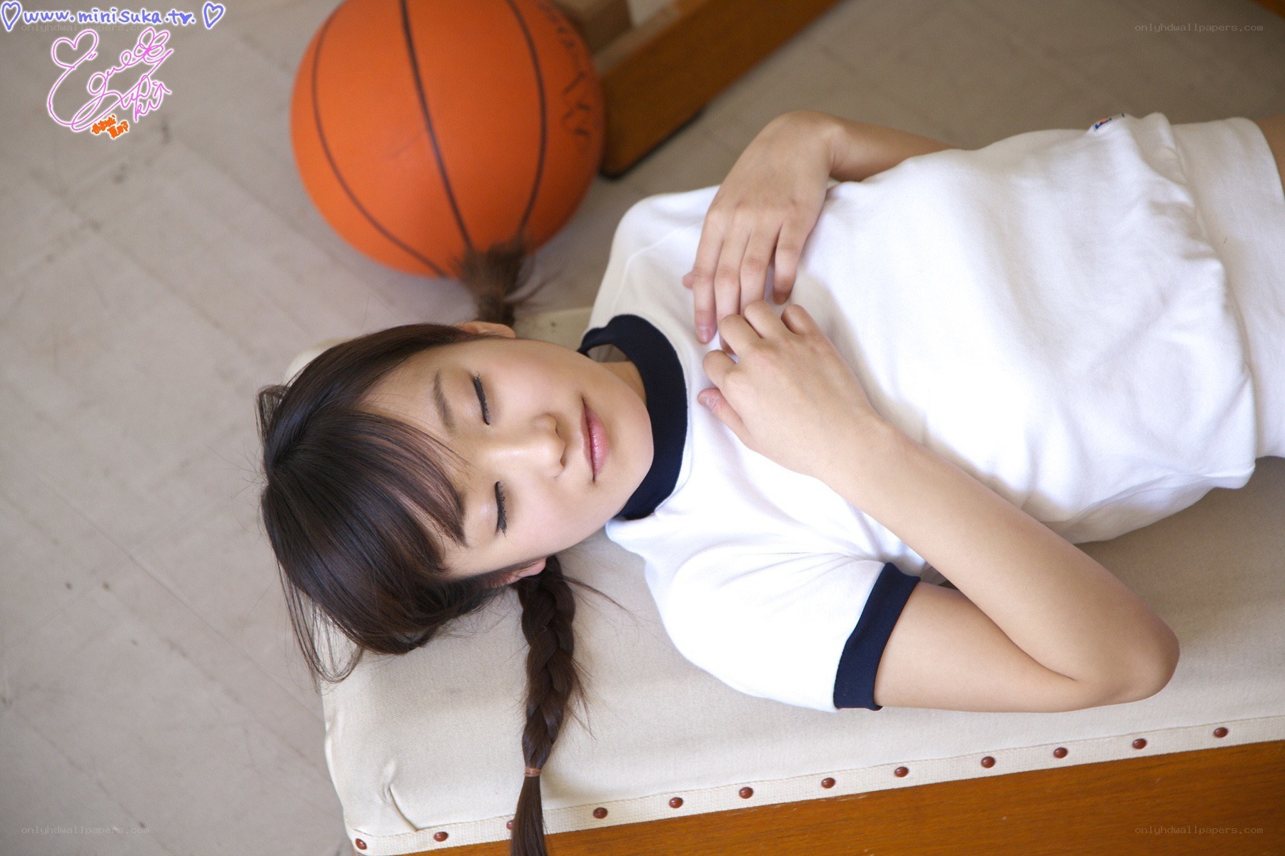 Girl resting with basketball