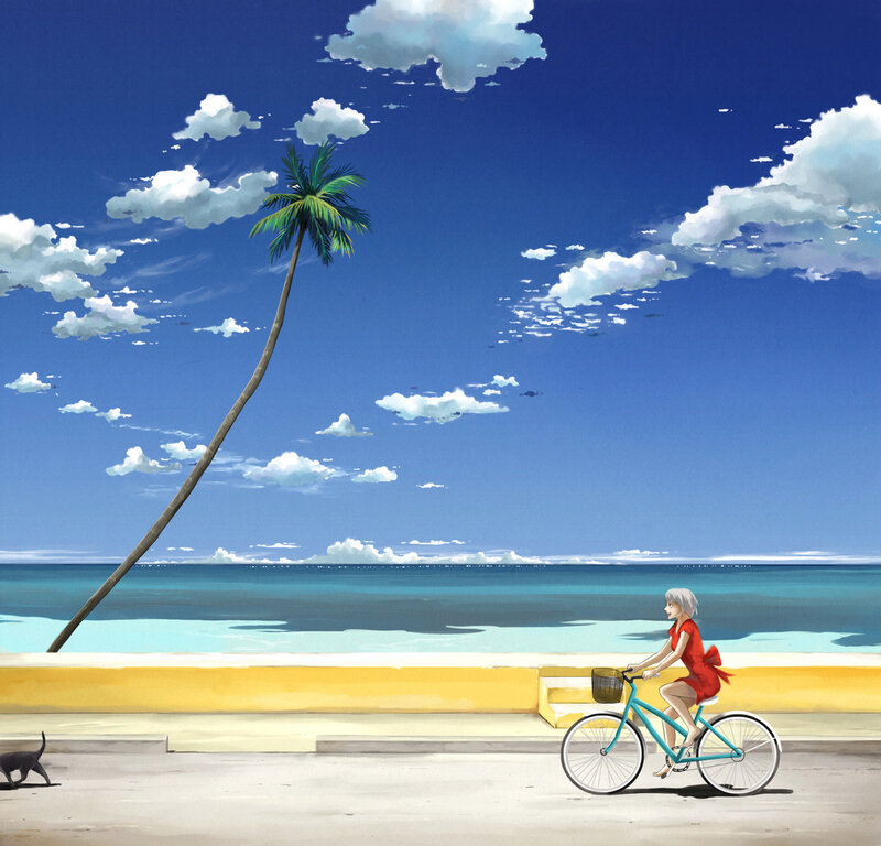 Girl riding bike on beach