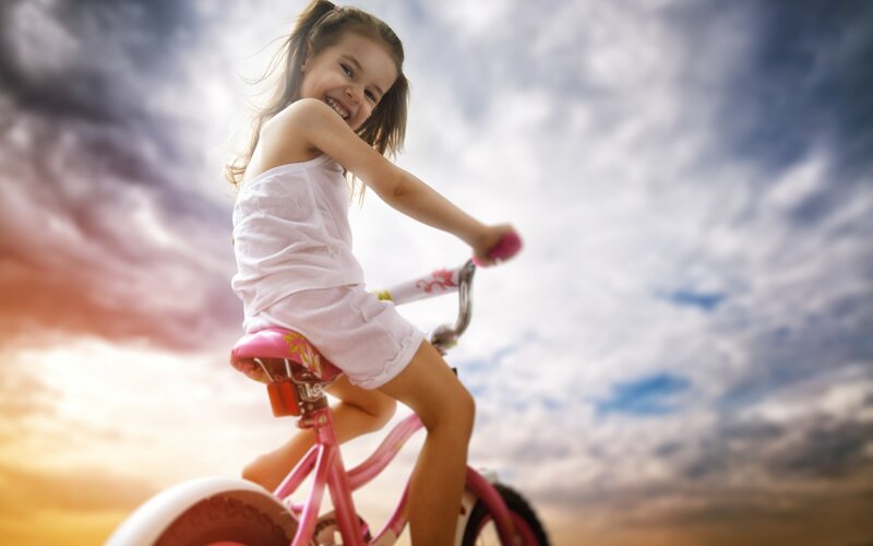 Girl Riding Pink Bike — Dramatic