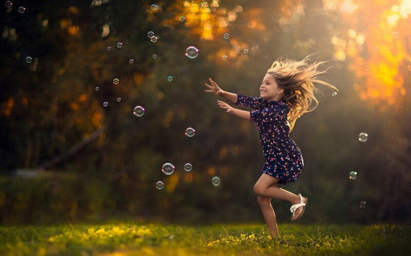 Girl Running in Field — Green, Playful