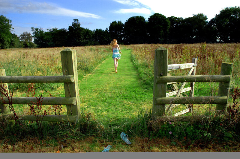 Girl Running in Field — Green, Serene