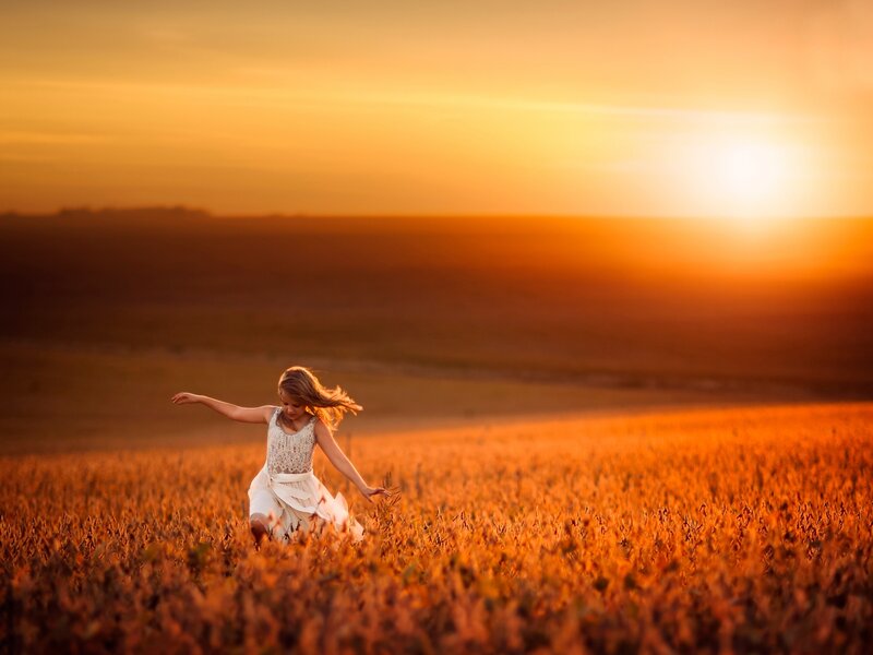 Girl Running in Field — Orange, Serene, Sunset