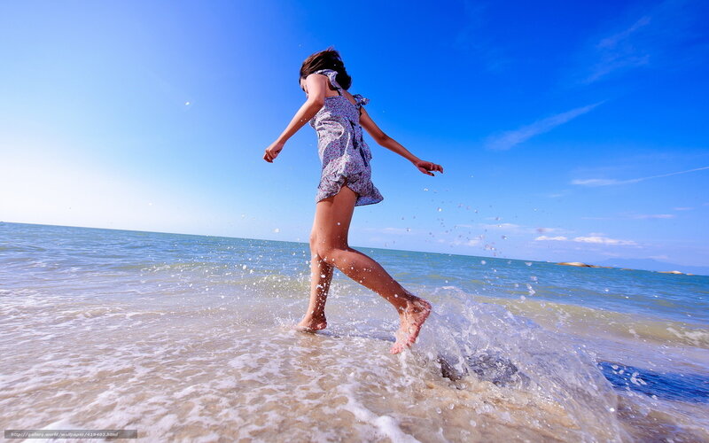 Girl Running in Ocean