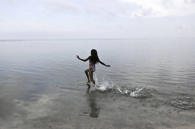 Girl Running in Water