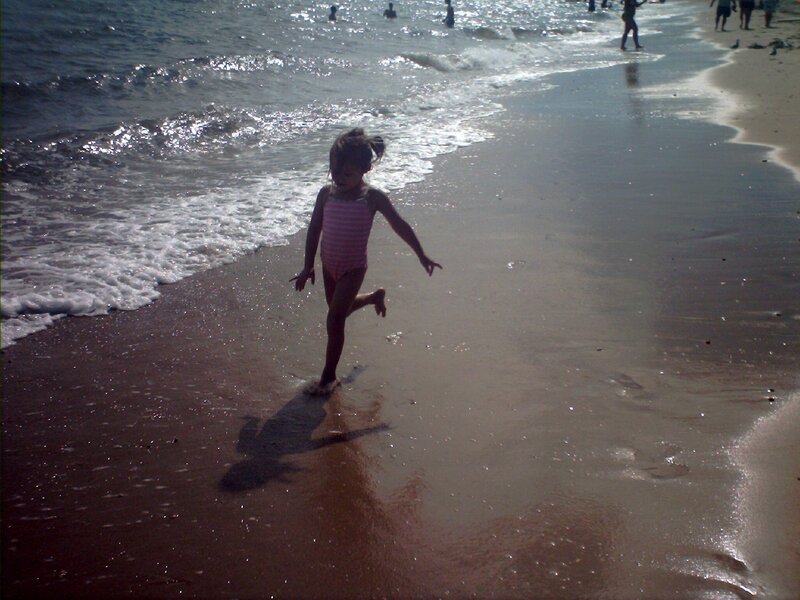 Girl Running on Beach — Brown