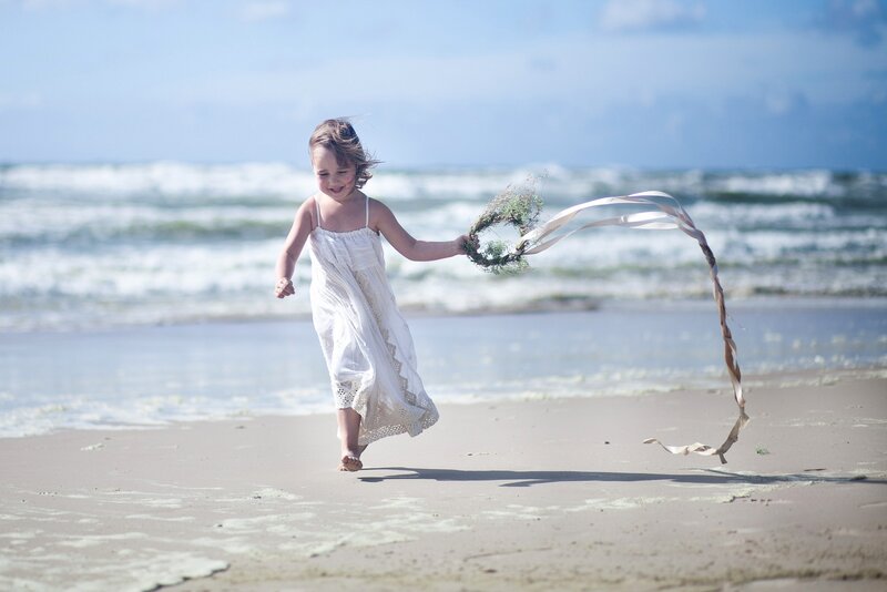 Girl Running on Beach — White