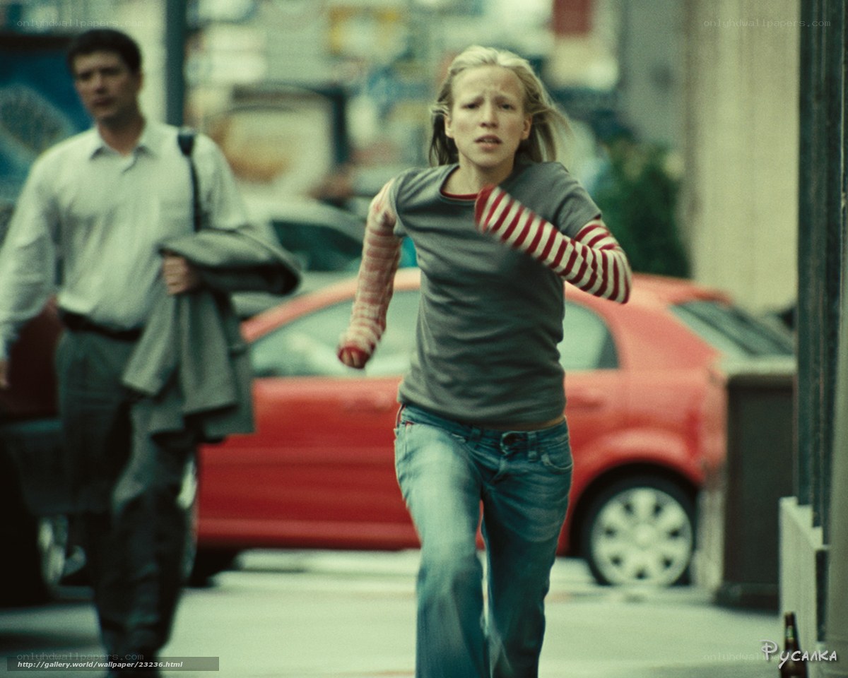 Girl running on city street
