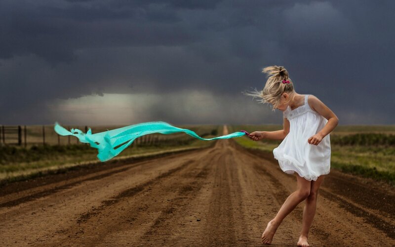 Girl Running on Dirt Road