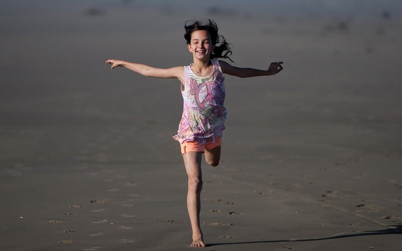 Girl running on the beach