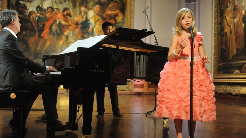 Girl sings with piano accompaniment