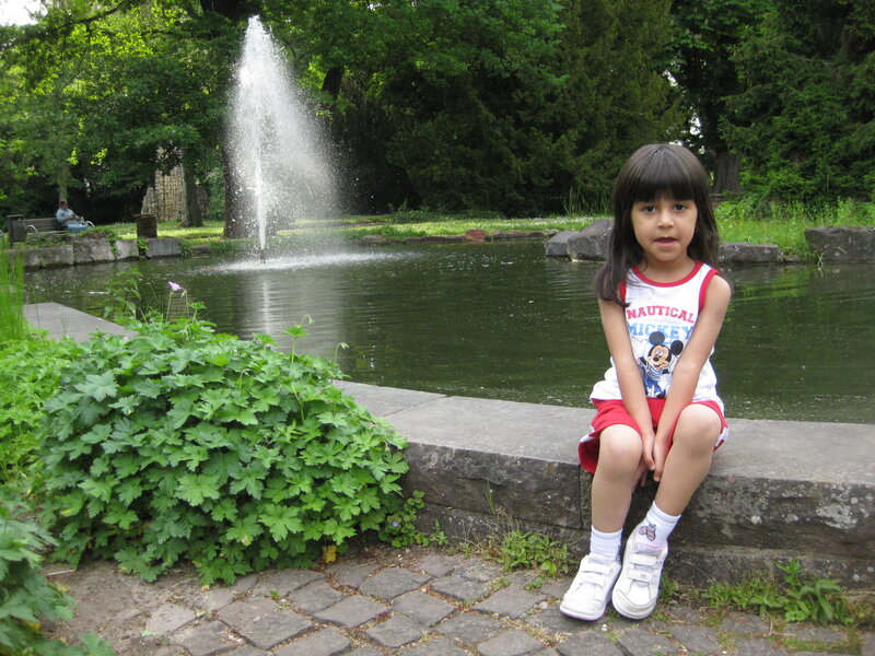 Girl Sitting by Pond