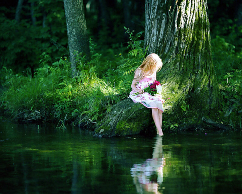 Girl Sitting by River