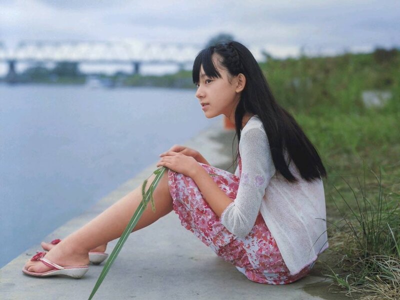 girl sitting by the river