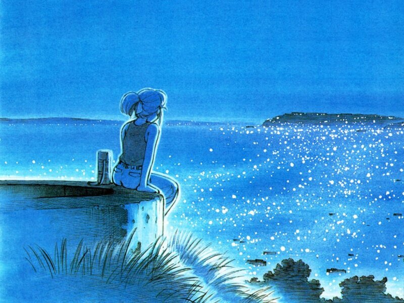 Girl sitting by the sea at night
