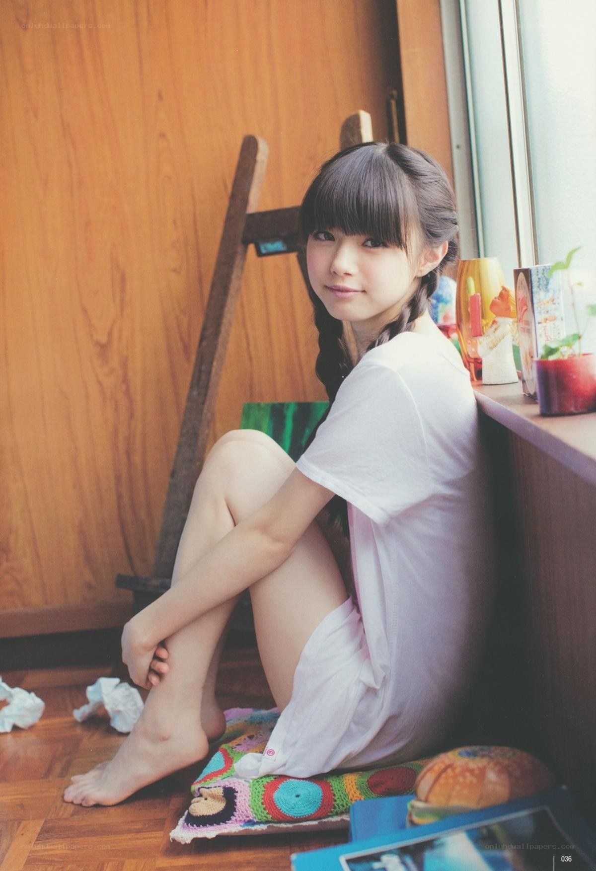 girl sitting by window