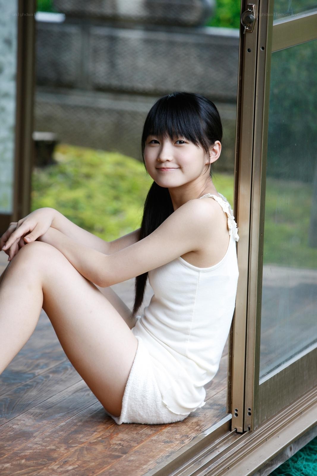 girl sitting by window