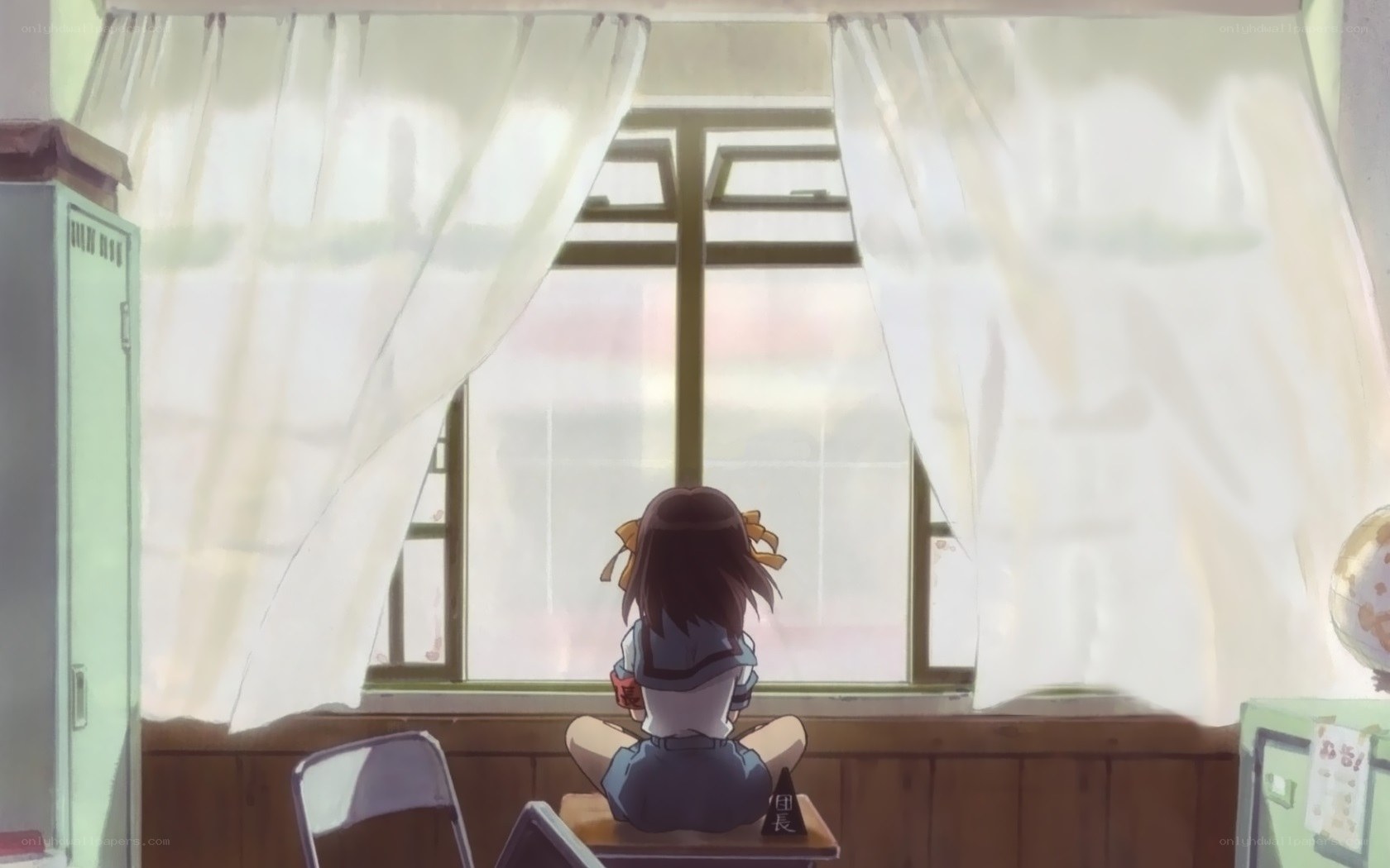 girl sitting by window