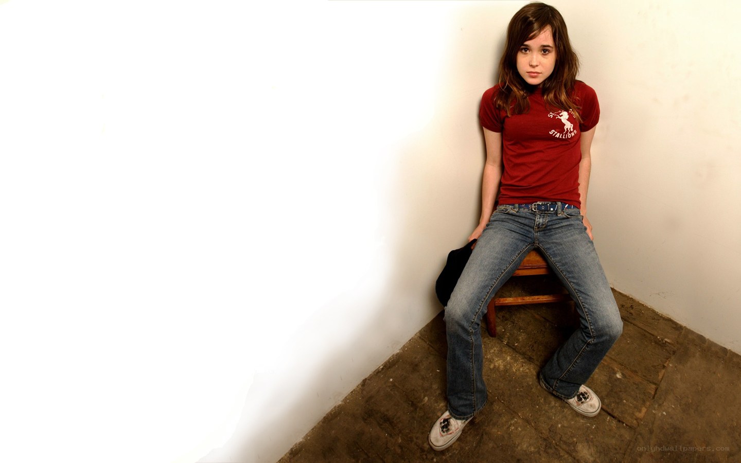 girl sitting in a corner