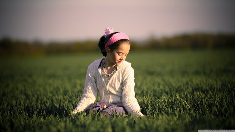 Girl Sitting in Field — Green