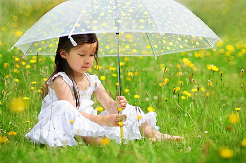 Girl Sitting in Field