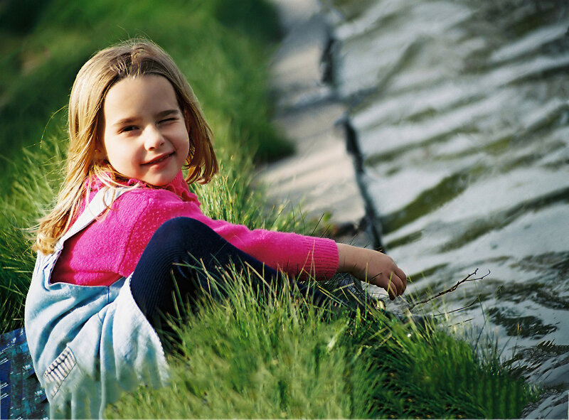 Girl Sitting in Grass
