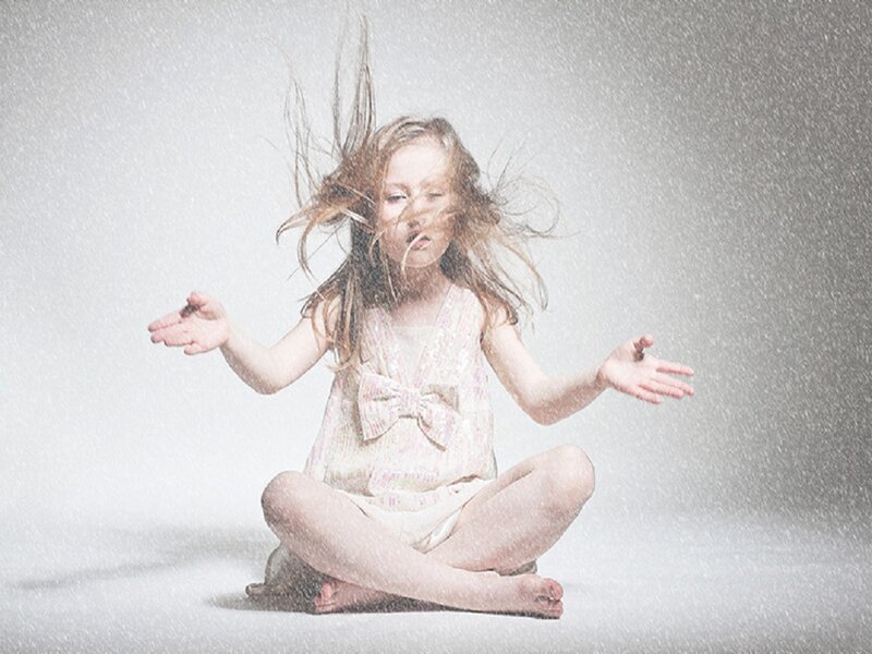 Girl Sitting in Snow — White