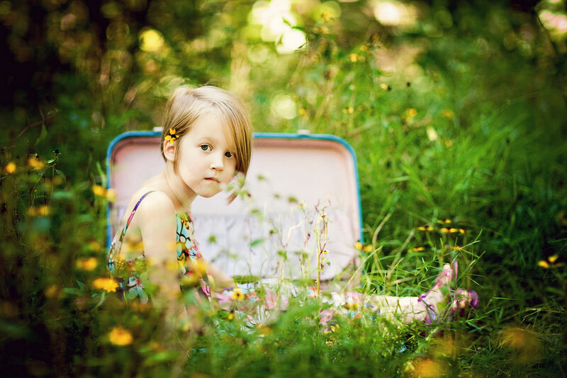 Girl Sitting in Suitcase — Green