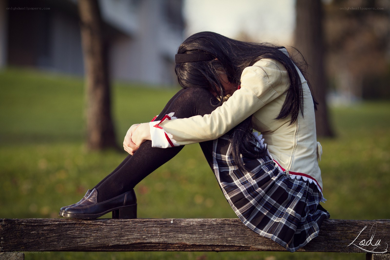 girl sitting on a bench