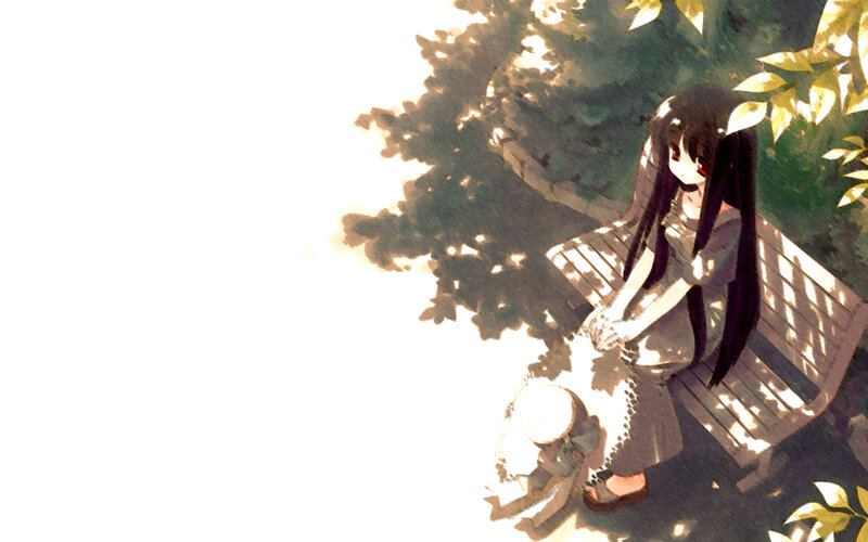 girl sitting on a bench in sunlight
